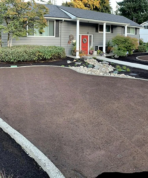 Irrigation systems, concrete curbs, plant design, and landscape rocks with grass seed in Fircrest 